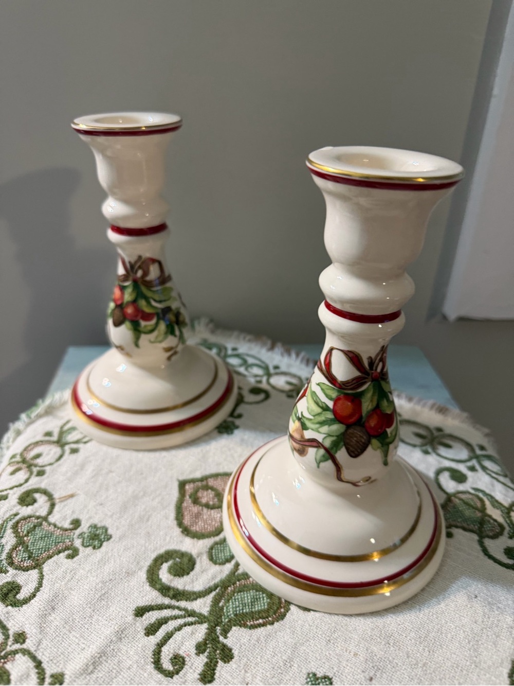 Tiffany & Co. Cream Candlestick Pair with Red and Gold Accents
